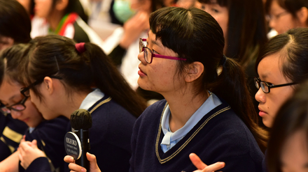Student asking questions during the Q&A session.