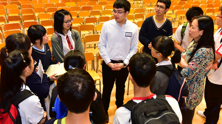 Theodore answering students' individual questions after the workshop.