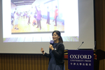 Ms Jenny Leung showing the audience a photo in which students were performing a freeze frame activity in her English class