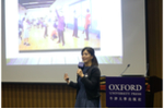 Ms Jenny Leung showing the audience a photo in which students were performing a freeze frame activity in her English class