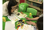 Participants try to make a catapult toy.