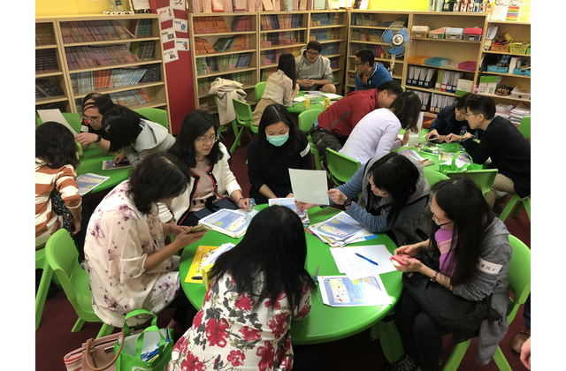 Participants explore the solution to making a rainbow with simple materials.