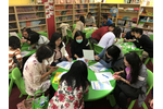 Participants explore the solution to making a rainbow with simple materials.