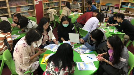 Participants explore the solution to making a rainbow with simple materials.