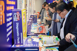 Teachers looking through Oxford English (Second Edition) before the seminar